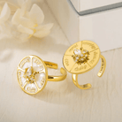 Gold spinner rings with engraved family names and central birthstones, perfect for making fun decisions and as customizable, unique gifts.