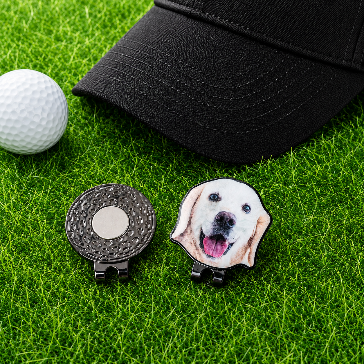 Personalized pet photo golf ball marker with magnetic hat clip beside black golf cap and white golf ball