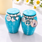 Mini cremation urn with custom photo displayed as a personalised memorial keepsake for a loved one or beloved pet.