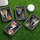 Multiple personalized photo golf divot tool and ball marker gift sets displayed on grass