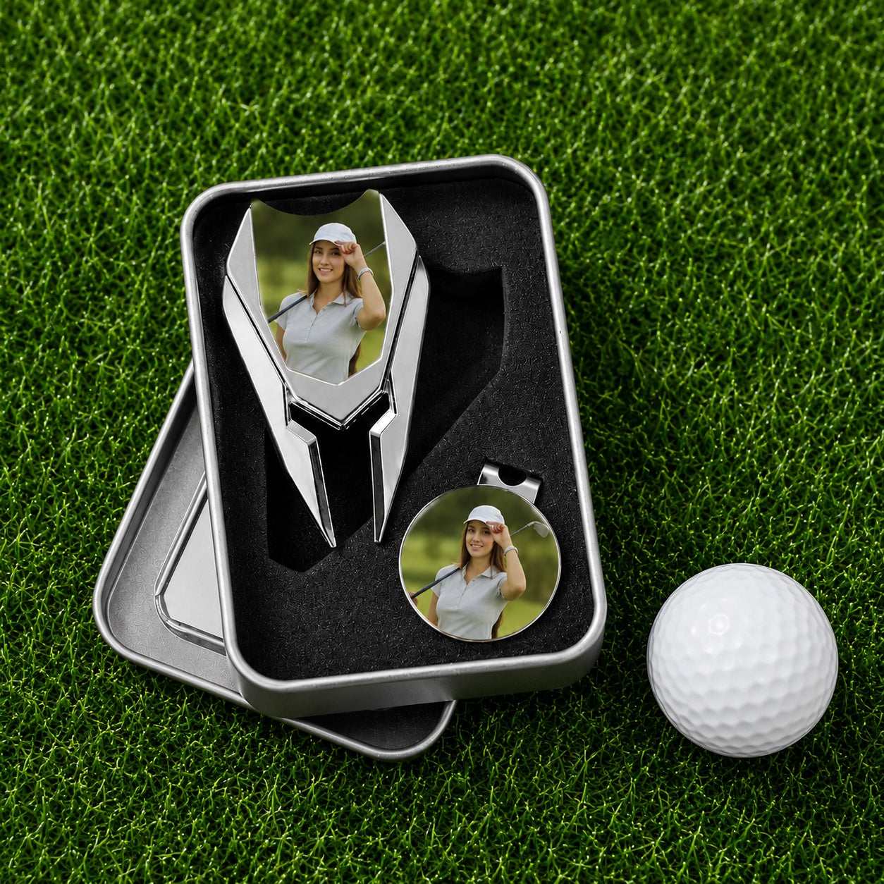 Personalized golf divot repair tool and photo ball marker set in case beside golf ball