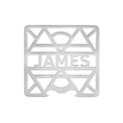 Isolated view of a personalized stainless steel coaster with 'JAMES' cutout, geometric pattern background.