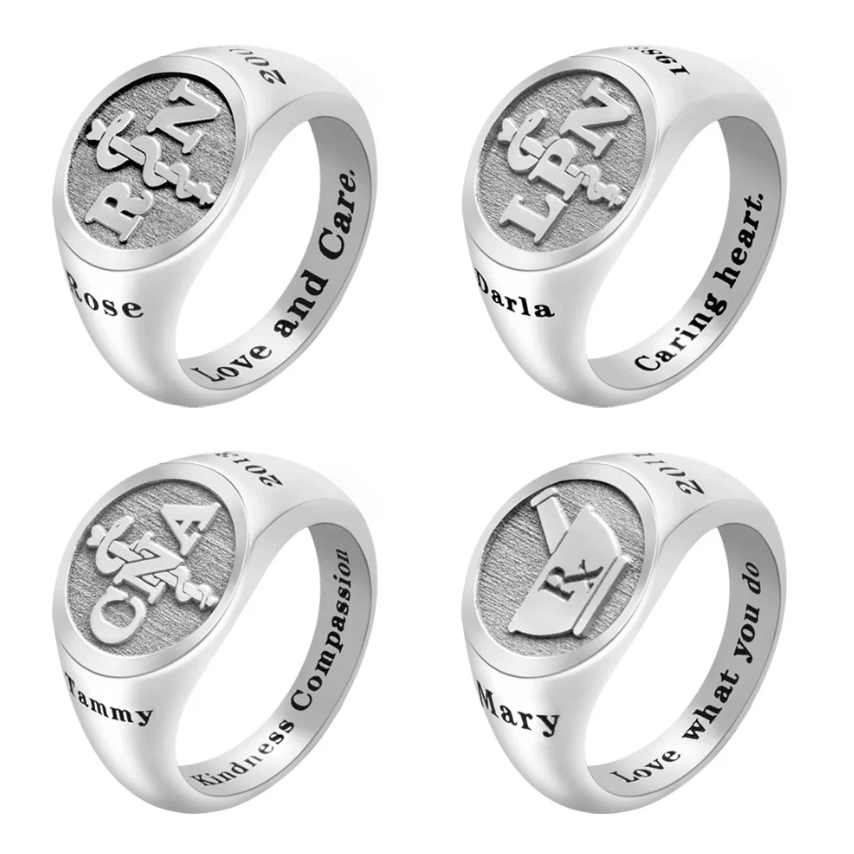 Four silver rings with engraved medical symbols and inscriptions. Each ring has a unique name and a different inspirational phrase inside the band.