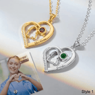 Two personalized heart-shaped necklaces with stethoscope designs, each featuring different birthstones and names: 'Sharlene' in gold with a ruby, 'Jennifer' in silver with an emerald.