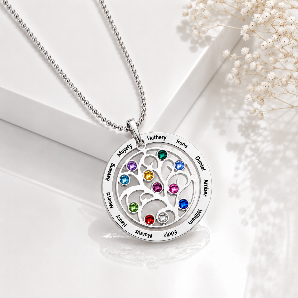 Personalized family tree necklace with engraved names and colorful birthstones in silver