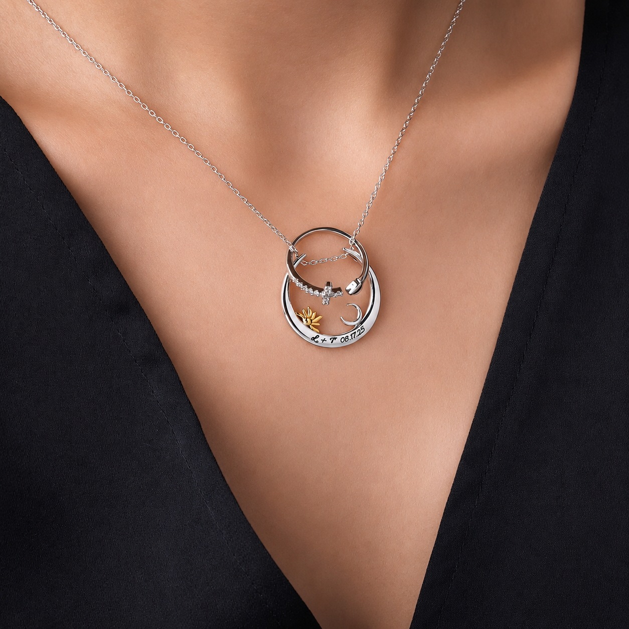 Sun and moon ring keeper pendant necklace worn with black top