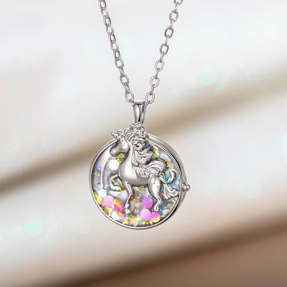 Silver round unicorn locket necklace displayed on a soft white background
