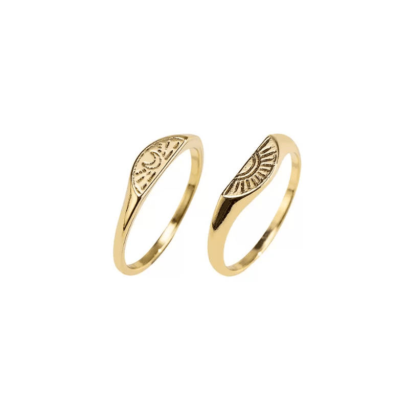 Gold-toned sun and moon engraved rings, symbolizing unity and harmony in a matching set.