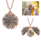 Rose gold sunflower locket necklace showing a photo of a smiling elderly couple.