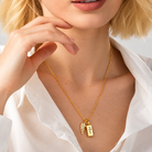 Woman wearing personalized tiny urn necklace for ashes