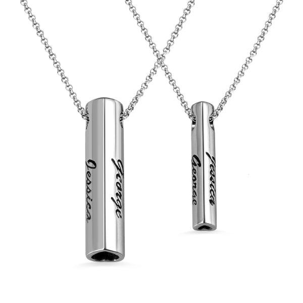 Personalized sterling silver bar pendant necklace set for couples, engraved with names Jessica and George, displayed on a delicate chain.