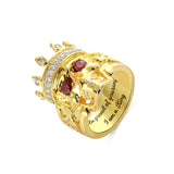 Gold skeleton king ring with crown, red gem eyes, diamonds, and 'I am a King' engraving.