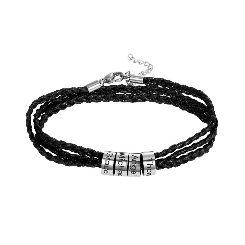 Black braided bracelet with silver beads engraved 'Thor', 'Angel', 'Michael', 'Grace', on a white background.