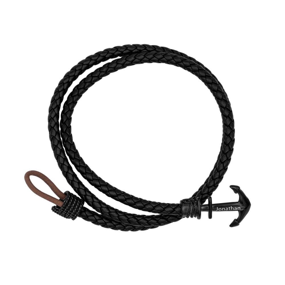 Black braided leather bracelet with custom-engraved black anchor clasp, named 'Jonathan'.