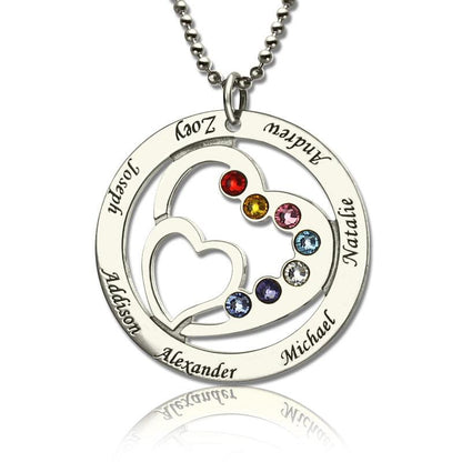 A silver pendant featuring a heart-in-heart design with birthstones and names: Addison, Alexander, Joseph, Zoey, Andrew, Michael, Natalie. The hearts are adorned with colorful gems.