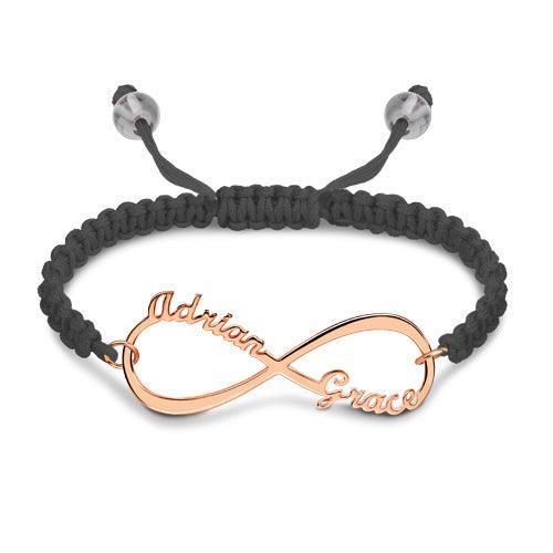 Rose gold infinity symbol bracelet with "Addison" and "Grace" engraved, on a black macrame band.