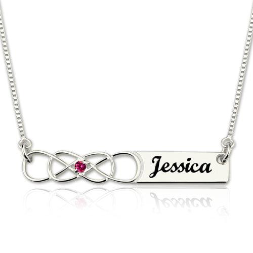 Personalized Double Infinity Knot Necklace with Birthstone in Sterling Silver, featuring the name "Jessica" engraved on a rectangular pendant.