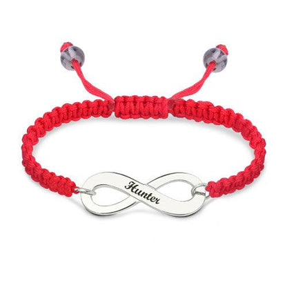 Customizable silver infinity symbol bracelet with 'Hunter' engraved, set on a vibrant red braided band with adjustable closure.