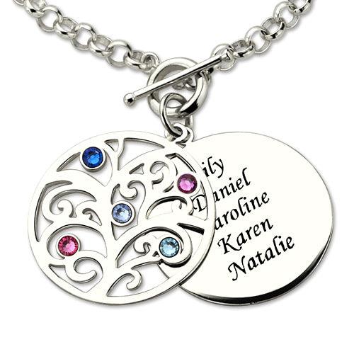A silver charm bracelet with a toggle clasp, featuring a tree pendant with colored gemstones and a round disc engraved with the names Lily, Daniel, Caroline, Karen, and Natalie.