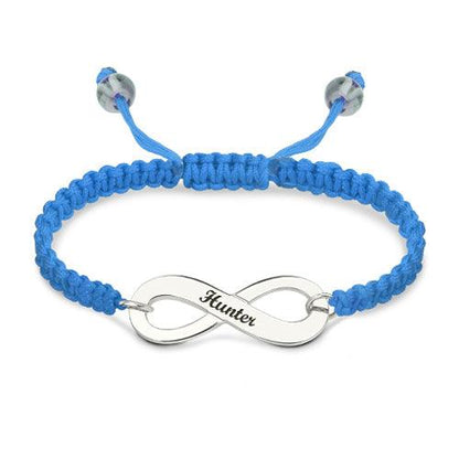 Customizable silver infinity symbol bracelet with 'Hunter' engraved, on a bright blue braided band with adjustable closure.