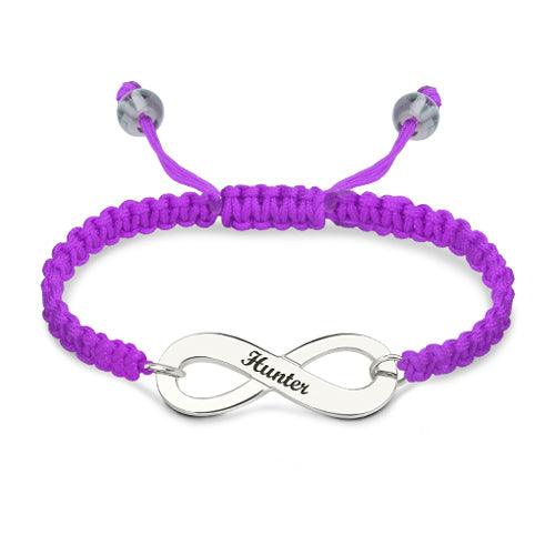 Customizable silver infinity symbol bracelet with 'Hunter' engraved, on a vivid purple braided band with adjustable closure.