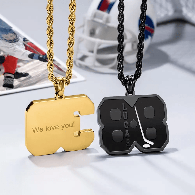 Two custom hockey-themed necklaces: one gold with "We love you!" engraving, and one black with the name "Lucas" and a hockey stick design.