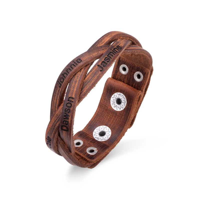 Custom engraved leather bracelet with names Johnnie, Jasmine, and Dawson, adorned with silver snap buttons.