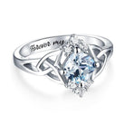 Silver Celtic knot ring with a blue stone and 'Forever my love' inscription on the band.