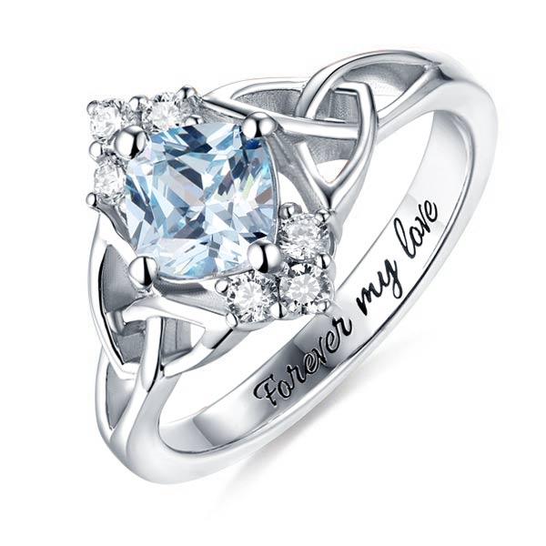 Sterling silver ring with aquamarine center, Celtic knots, side gems, and 'Forever my love' engraving.