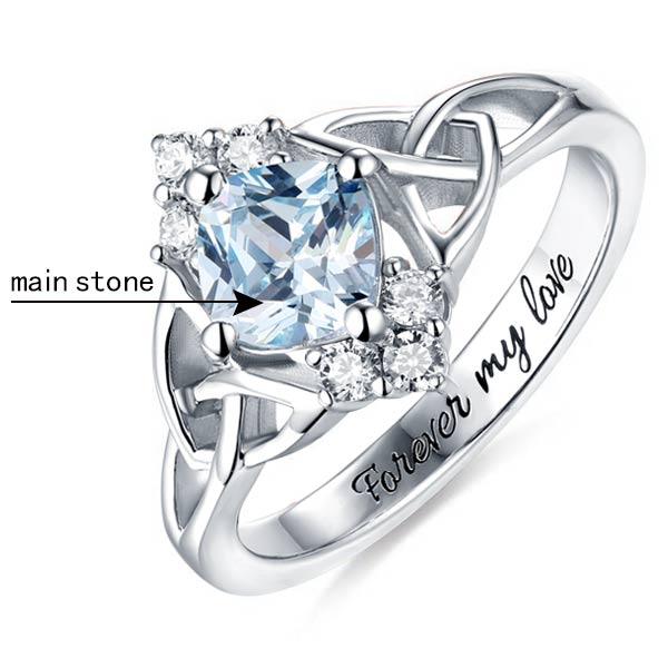 Silver Celtic knot ring with an aquamarine center stone and 'Forever my love' engraving.