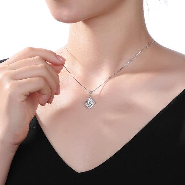 Woman wearing a Custom Diamond Monogram Necklace in Sterling Silver 925 with Infinity Symbol, featuring personalized engraving and dazzling simulated diamonds.