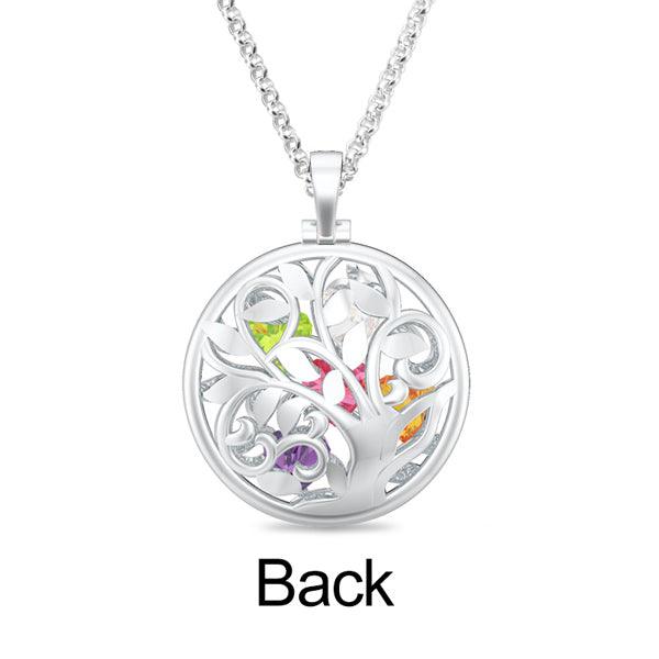 Back view of a silver necklace with a circular pendant featuring an intricate tree design and multicolored gemstones embedded within the branches.