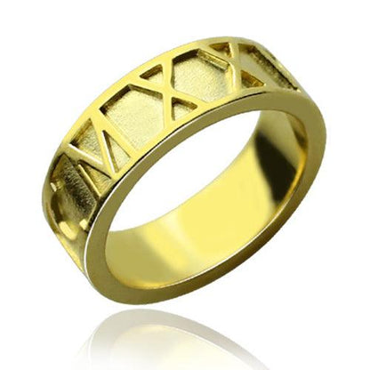 Gold ring with engraved Roman numerals on the outer band and a polished, reflective inner surface.