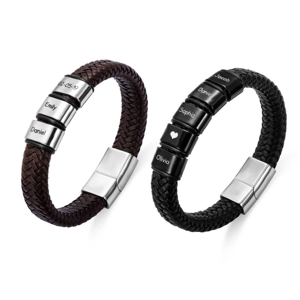 Two braided leather bracelets with stainless steel clasps, one brown and one black, each engraved with names and a date.