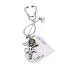 A silver nursing brooch shaped like a stethoscope, featuring a medical emblem and personalized text reading "Sophia" and "2020 Aug."