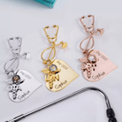 Three customized nursing brooches in silver, gold, and rose gold, each featuring a stethoscope shape, a medical emblem, and personalized text reading "Sophia" and "Grad 2022."