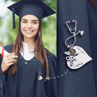 A smiling graduate in a cap and gown wears a silver nursing brooch with a stethoscope shape, medical emblem, and text reading "Sophia" and "Grad 2022."