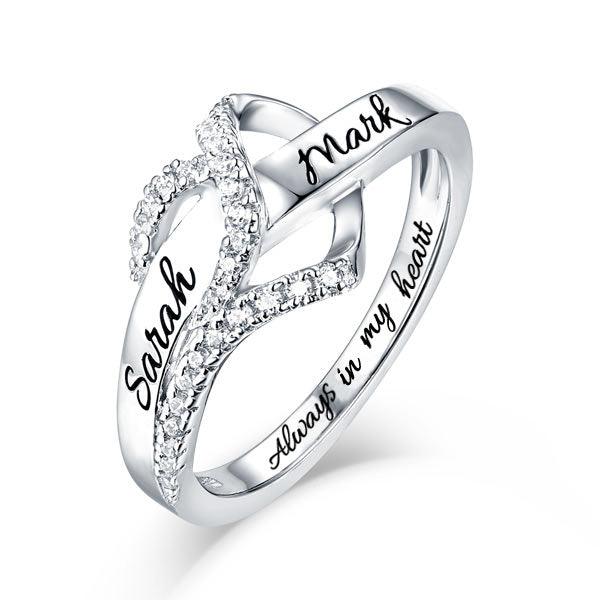Personalized infinity ring with names 'Sarah' and 'Mark' engraved, adorned with cubic zirconia on a 925 sterling silver band