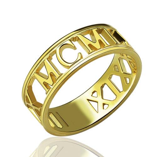 A gold ring in Cut-Out style featuring intricate Roman numerals, with "MCM" and "XIX" prominently displayed in the design.