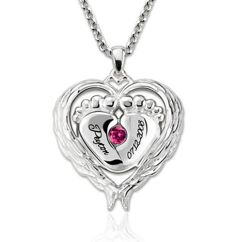 Silver heart-shaped necklace pendant featuring baby feet, engraved with the name "Peyton" and the date "07.22.2008," adorned with a pink gemstone.