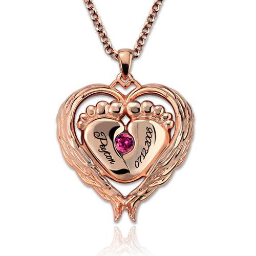 Rose gold heart-shaped necklace pendant featuring baby feet, engraved with the name "Peyton" and the date "07.22.2008," adorned with a pink gemstone.