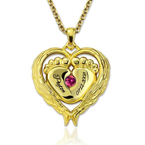 Gold heart-shaped necklace pendant featuring baby feet, engraved with the name "Peyton" and the date "07.22.2008," adorned with a pink gemstone.