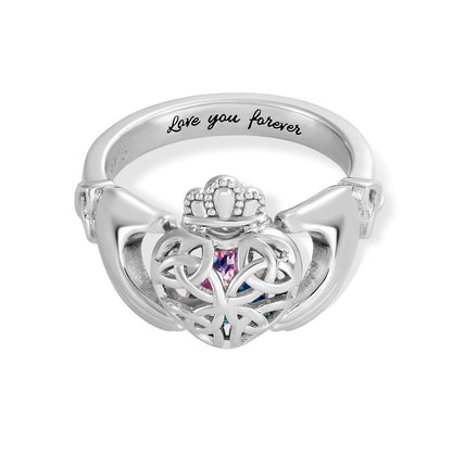 Silver Claddagh ring with gemstone heart, crown top, and "Love you forever" engraving on the band.