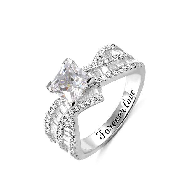 Elegant sterling silver engagement ring featuring a sparkling princess cut gemstone, shimmering accent stones, and personalized engraving that reads "Forever Love.