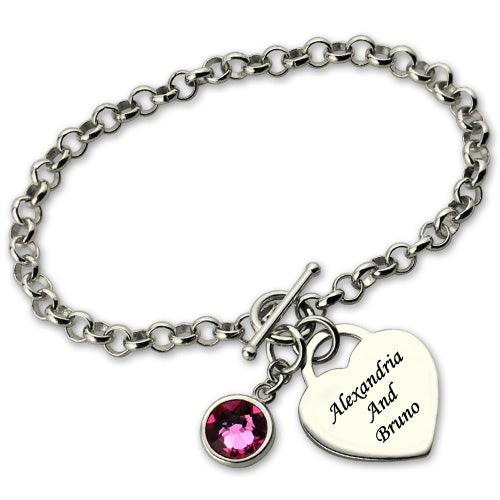 Personalized heart charm bracelet with birthstone and engraved names "Alexandria and Bruno", crafted in sterling silver with a toggle clasp and woven link design.