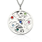 A round silver double pendant necklace featuring a Tree of Life design with colorful gemstones. The front pendant eclipses the back pendant, which has engraved names.