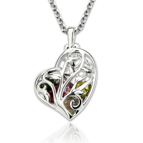 A heart-shaped silver pendant with an intricate tree design, showcasing colorful gemstones, suspended on a thick silver chain.