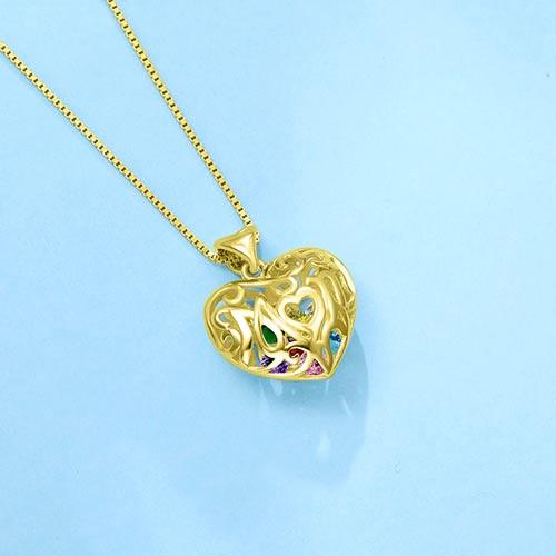 Gold open heart pendant with "Mom" inscribed, featuring colorful birthstones inside, on a box chain necklace against a light blue background.