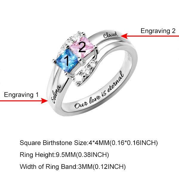 A silver ring featuring two colorful gemstones, each numbered, and engraved names corresponding to each stone, along with size specifications at the bottom. The ring includes the engraving "Our love is eternal."