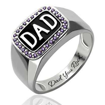 Silver ring with "DAD" in black, surrounded by purple gemstones and engraved "Dad You Rock" on the band.